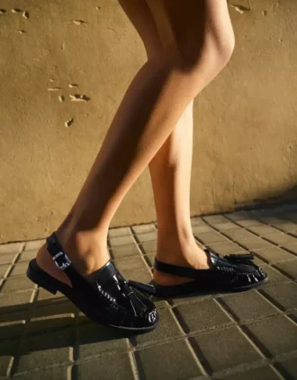Loafers zonder achterkant met kwastjes